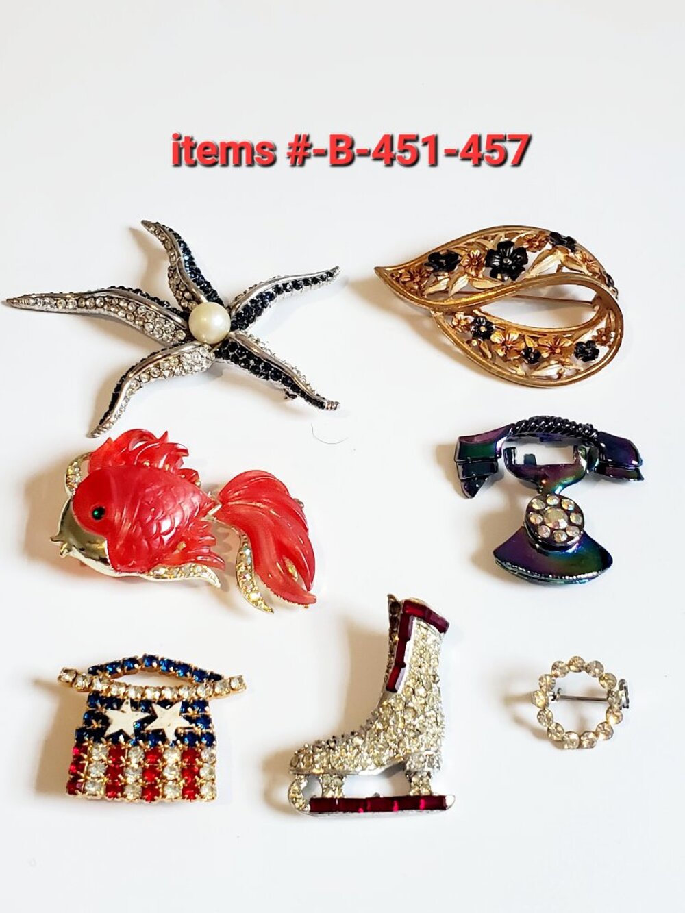 7 Brooches, items # B-451-457,. wt .  93 grams.